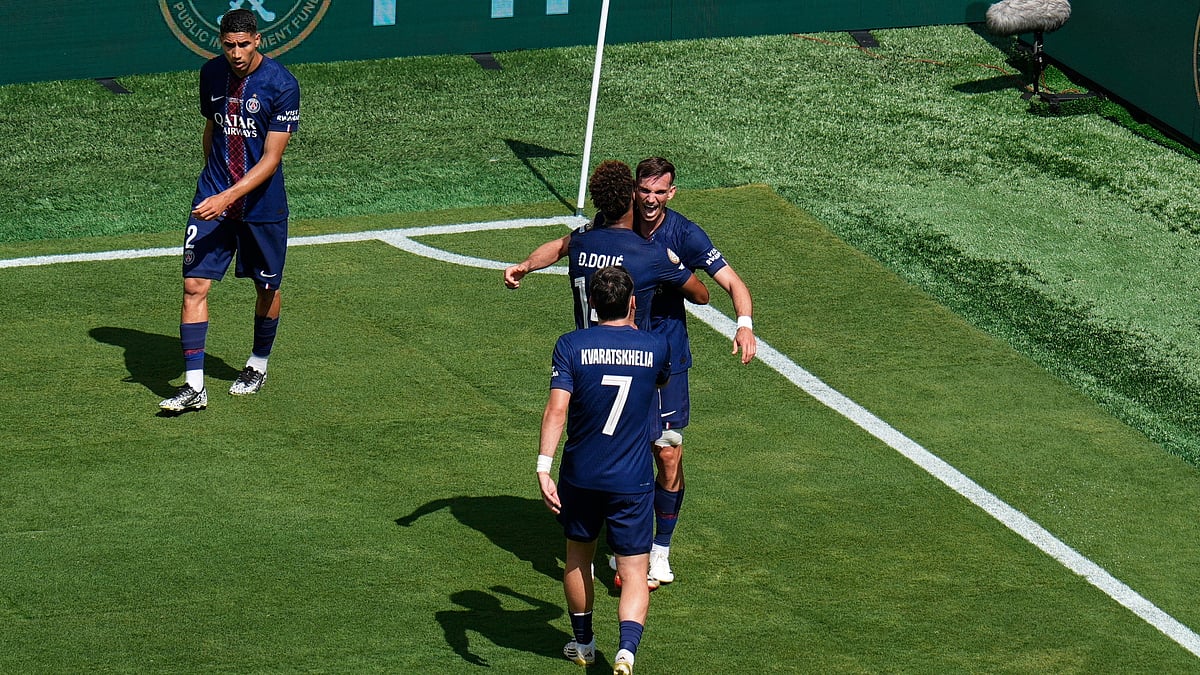 | Photo: AP/Pamela Smith : PSG vs Real Madrid, FIFA Club World Cup 2025: Paris Saint-Germain's Fabian Ruiz is hugged by Desire Doue as the two celebrate Ruiz's second goal during the Club World Cup semifinal soccer match between PSG and Real Madrid in East Rutherford, N.J., Wednesday, July 9, 2025.