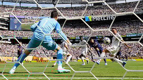 Paris Saint-Germain's Goncalo Ramos scores his side's fourth goal past Real Madrid's goalkeeper Thibaut Courtois during the Club World Cup semifinal soccer match between PSG and Real Madrid in East Rutherford, N.J., Wednesday, July 9, 2025.