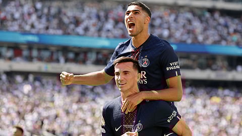 Paris Saint-Germain's Fabian Ruiz celebrates with team mate Achraf Hakimi after scoring his side's third goal during the Club World Cup semifinal soccer match between PSG and Real Madrid in East Rutherford, N.J., Wednesday, July 9, 2025.