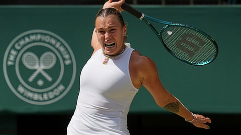 Aryna Sabalenka of Belarus returns to Amanda Anisimova of the U.S. during a women's singles semifinal match at the Wimbledon Tennis Championships in London, Thursday, July 10, 2025.