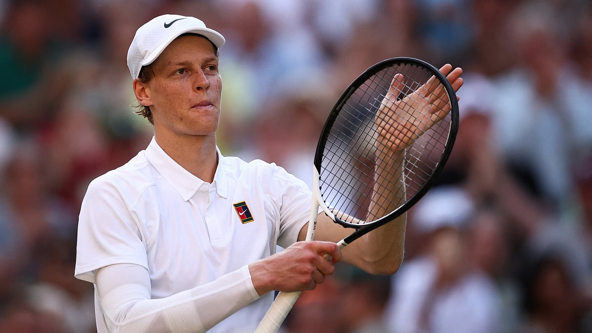 Jannik Sinner celebrates his victory over Novak Djokovic