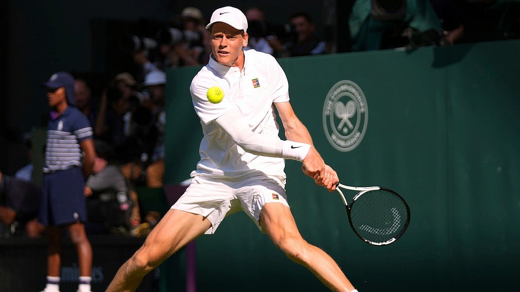 Photo: AP : Jannik Sinner Vs Novak Djokovic Live Score, Wimbledon 2025 Semi-Final: The Italian returns during the first set.