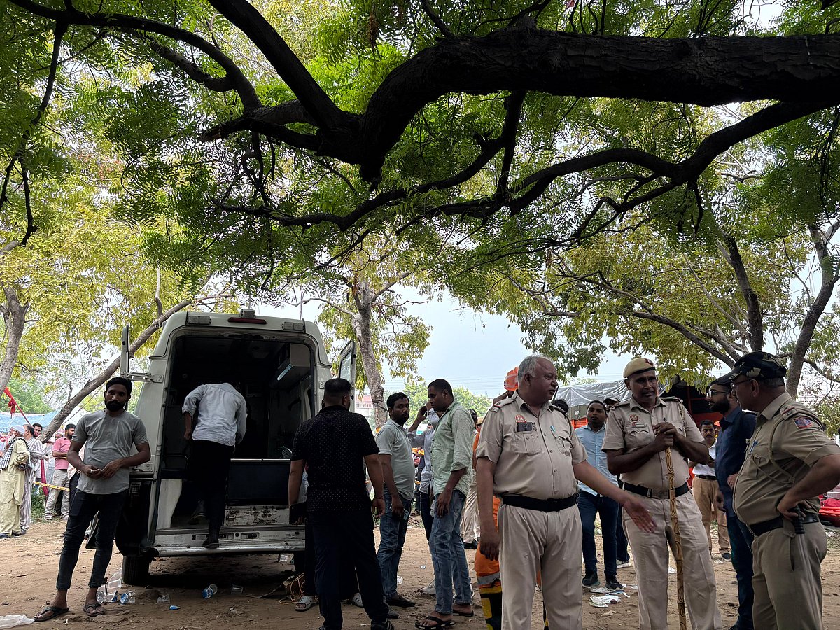 Abhijay Raj Vaish : Police officers and rescue personnel gather near an ambulance at the site of the building collapse in Delhi’s Janta Mazdoor Colony on Saturday