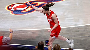 Caitlin Clark celebrates during Indian Fever's match against Atlanta Dream.