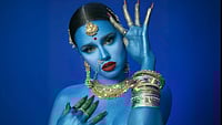 | Instagram |  : Canadian rap artist Tommy Genesis with her skin painted in vivid blue