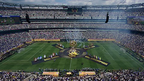 Robbie Williams and Laura Pausini perform prior to the Club World Cup final soccer match between Chelsea and PSG in East Rutherford, N.J., Sunday, July 13, 2025.