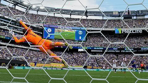 Paris Saint-Germain's goalkeeper Gianluigi Donnarumma (1) makes a diving save on a shot by Chelsea's Liam Delap (9) during the Club World Cup final soccer match between Chelsea and PSG in East Rutherford, N.J., Sunday, July 13, 2025