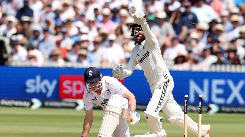 Indias substitute wicketkeeper Dhruv Jurel, celebrates the dismissal of Englands Harry Brook