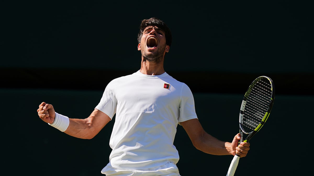 (AP Photo/Kirsty Wigglesworth) : Carlos Alcaraz of Spain celebrates winning the men's semifinal singles match against Taylor Fritz of the U.S. at the Wimbledon Tennis Championships in London, Friday, July 11, 2025.