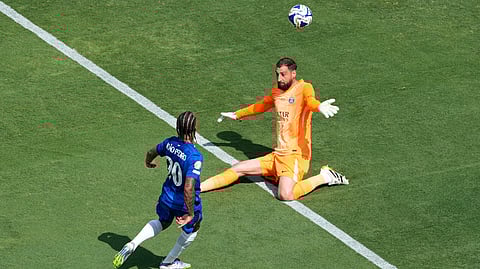 Chelsea's Joao Pedro, left, scores his side's 3rd goal in front of Paris Saint-Germain's goalkeeper Gianluigi Donnarumma during the Club World Cup final soccer match between Chelsea and PSG in East Rutherford, N.J., Sunday, July 13, 2025.