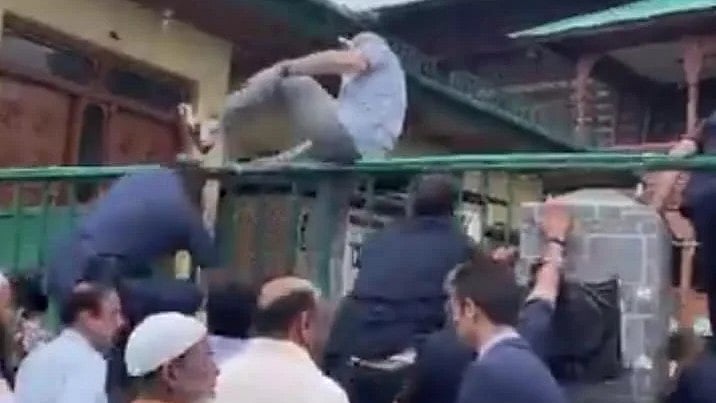 JKNC Twitter Handle : Screen grab from the video where Omar Abdullah is seen climbing over the wall