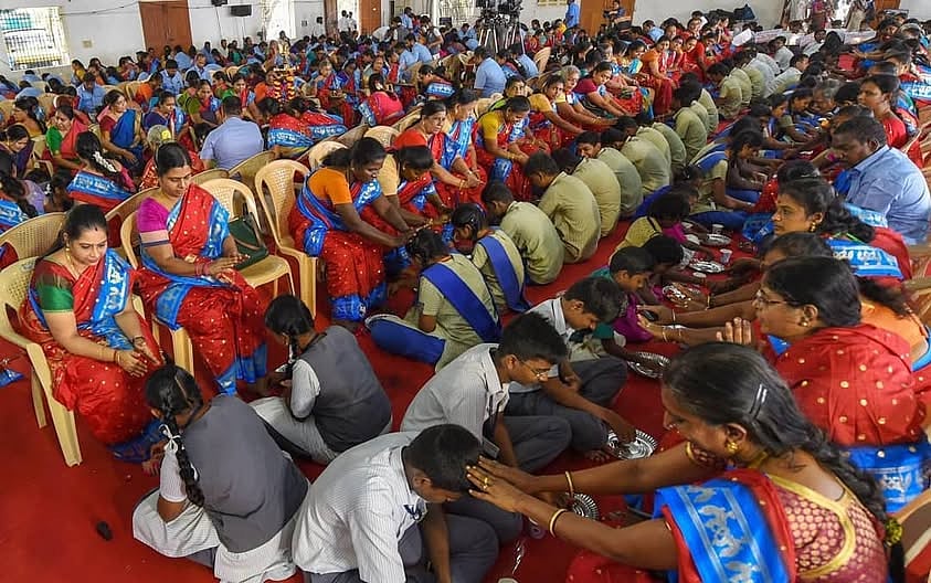 Students performing the 'Pada Pooja' in Kerala - PTI