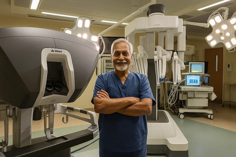 Healthcare worker standing in front of a robotic surgical system