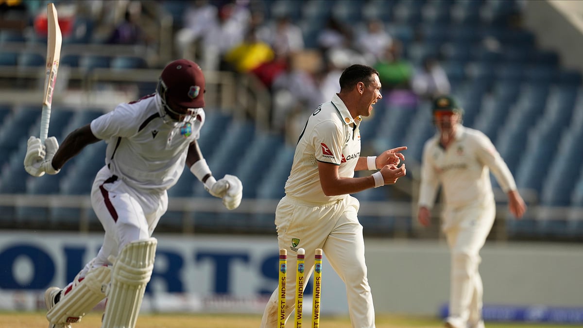 (AP Photo/Ricardo Mazalan) : Australia's Scott Boland celebrates running out West Indies' Justin Greaves on day two of the third Test cricket match at Sabina Park in Kingston, Jamaica, Sunday, July 13, 2025.