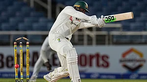 | Photo: AP/Ricardo Mazalan : WI vs AUS Live Score, 3rd Test Day 2: Australia's Usman Khawaja is bowled by West Indies' Shamar Joseph on day two of the third Test cricket match at Sabina Park in Kingston, Jamaica, Sunday, July 13, 2025.