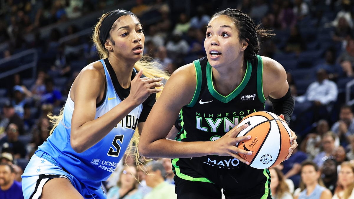 Napheesa Collier #24 of the Minnesota Lynx battles with Angel Reese #5 of the Chicago Sky during the fourth quarter at Wintrust Arena on July 14, 2025 in Chicago, Illinois.