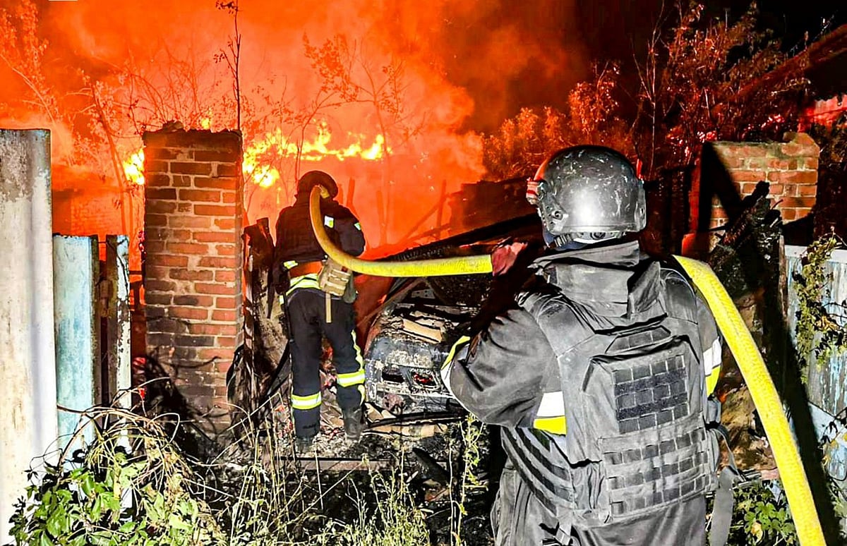  (Ukrainian Emergency Service via AP) : Firefighters try to put out a fire following a Russian attack in Kharkiv region, Ukraine, Tuesday, July 15, 2025.
