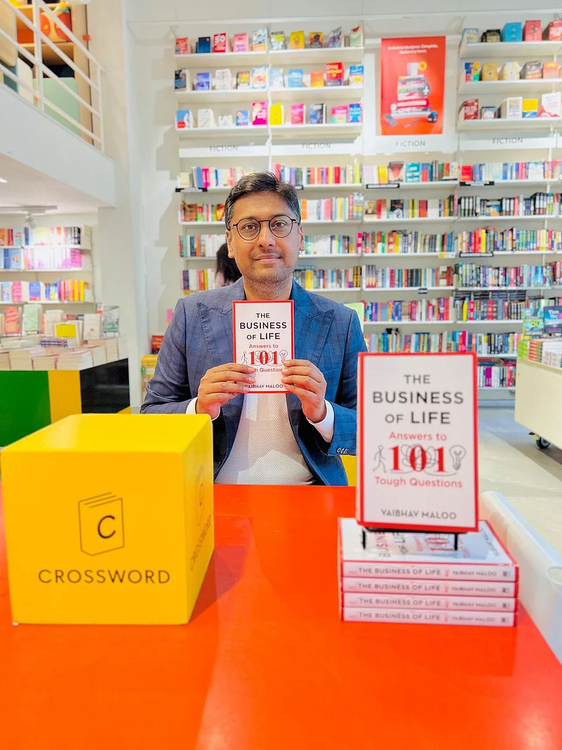 Vaibhav Maloo holding his book The Business of Life