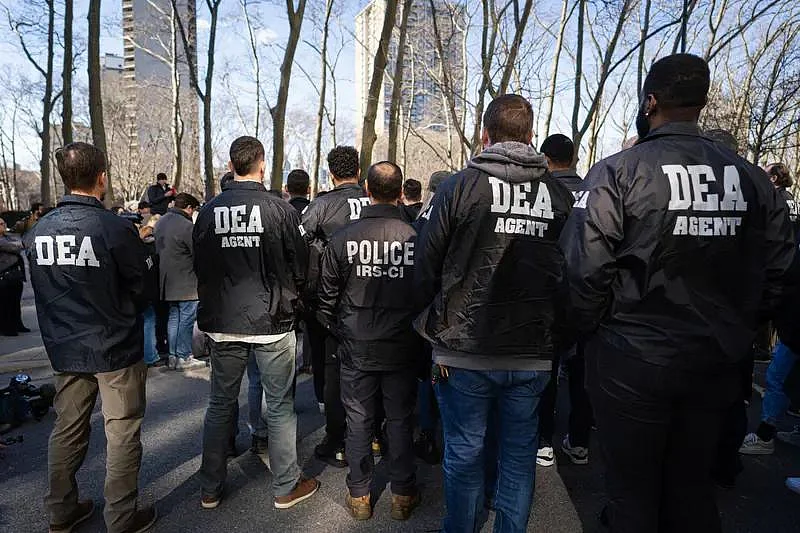 DEA agent stamding together