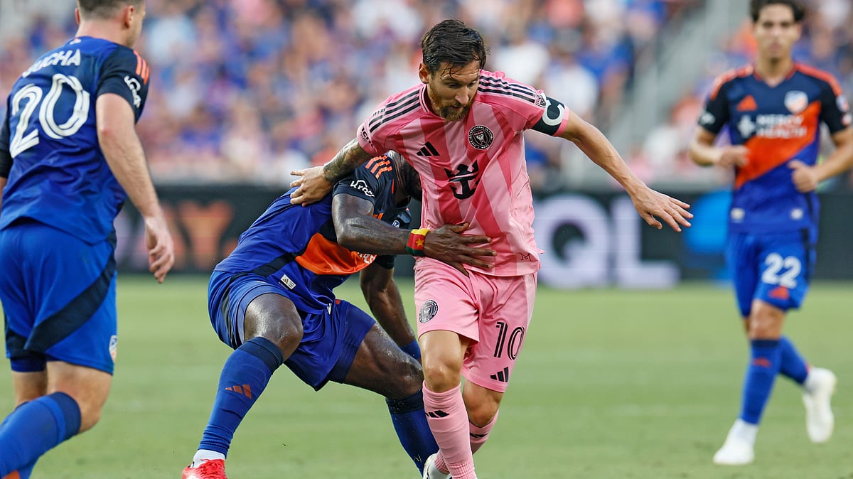 Inter Miami's Lionel Messi, right, keeps the ball away from FC Cincinnati's Tah Brian Anunga during the first half of an MLS soccer match, Wednesday, July 16, 2025, in Cincinnati.  - (AP Photo/Jay LaPrete)