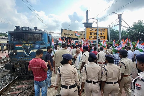 Odisha Bandh: Congress workers stage a protest at a railway station