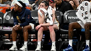 Caitlin Clark of the Indiana Fever sits on the bench after injuring her groin in a win over the Connecticut Sun on Tuesday, July 15.