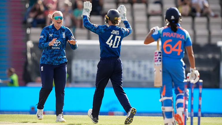 England's Sophie Ecclestone, left, celebrates with Amy Jones after taking the wicket of India's Pratika Rawal (64) during the fifth women's cricket IT20 at the Utilita Bowl, Southampton, England, Wednesday July 16, 2025.  - | Photo: AP/Andrew Matthews