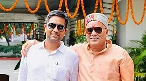 X : Chaitanya(L) son of Bhupesh Baghel(R)