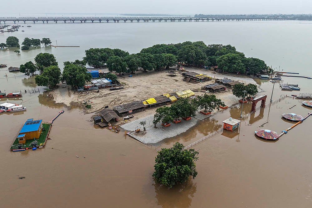 | Photo: PTI : Swollen Ganga floods nearby areas