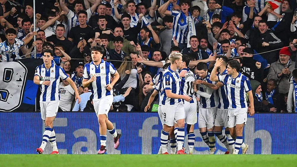 | Photo: AP/Miguel Oses : Real Sociedad team players celebrate a goal.