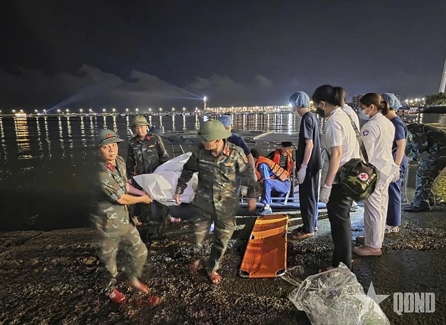 (QDND via AP) : This image from a video provided by QDND shows a body being carried on stretcher after a tourist boat capsized in Ha Long Bay, Vietnam on Saturday, July 19, 2025. (QDND via AP)