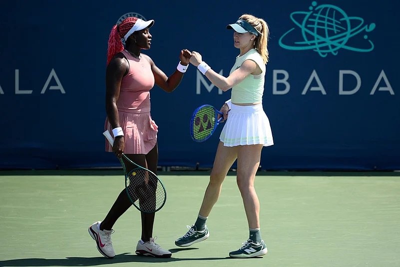 Eugenie Bouchard, right, and Clervie Ngounoue, left
