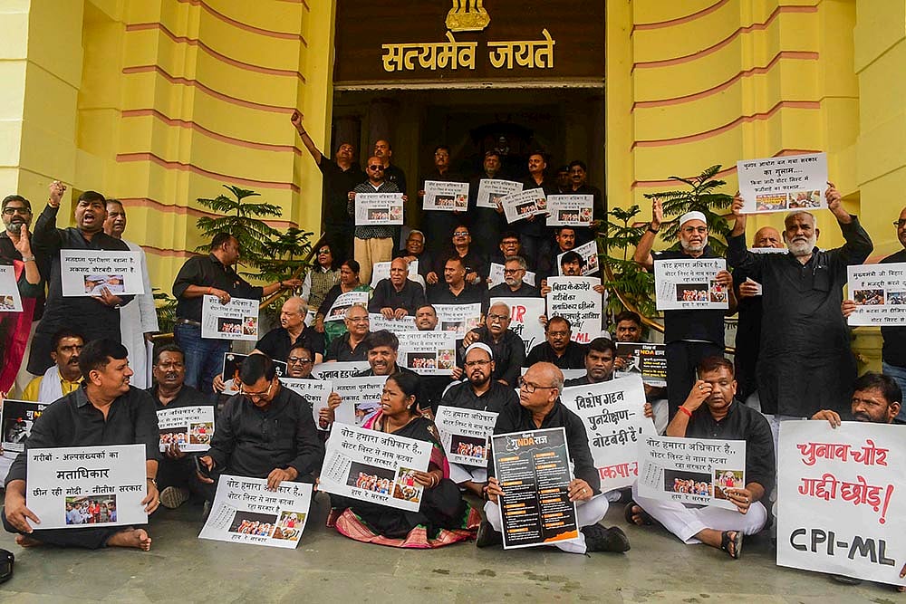 | Photo: PTI : Opposition MLAs protest against SIR