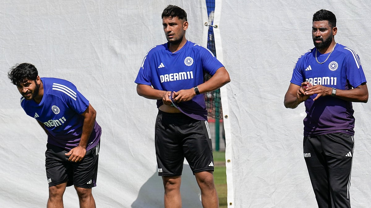 PTI : India vs England, 4th Test: Anshul Kamboj (centre) training in the nets in Manchester.