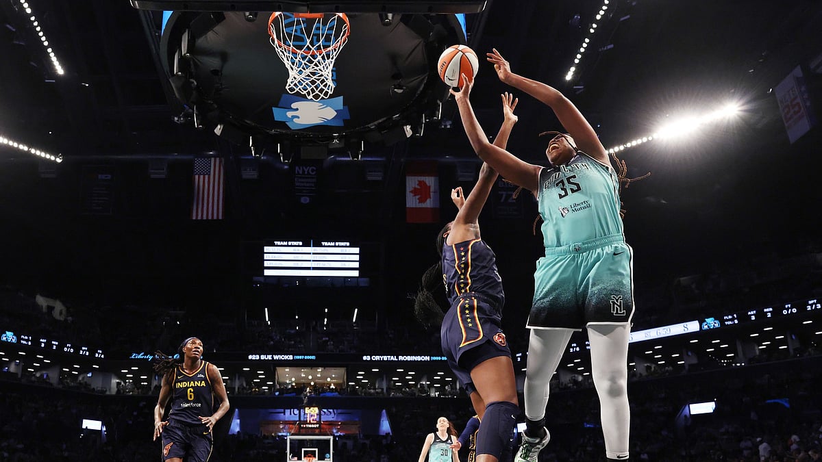 Jonquel Jones #35 of the New York Liberty shoots against Aliyah Boston #7 of the Indiana Fever during their game at Barclays Center on July 22, 2025 in New York City.