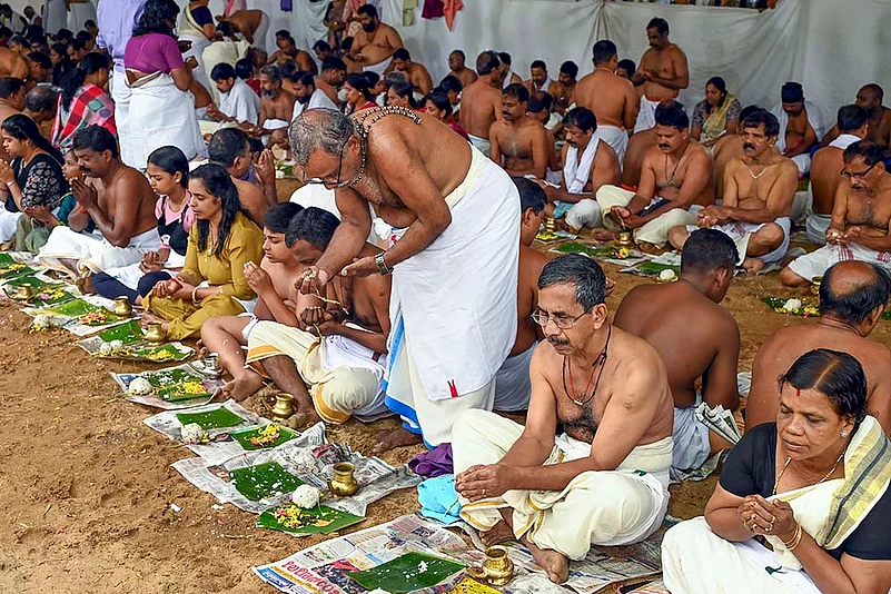 People perform Karkidaka Vavu Bali in Kerala