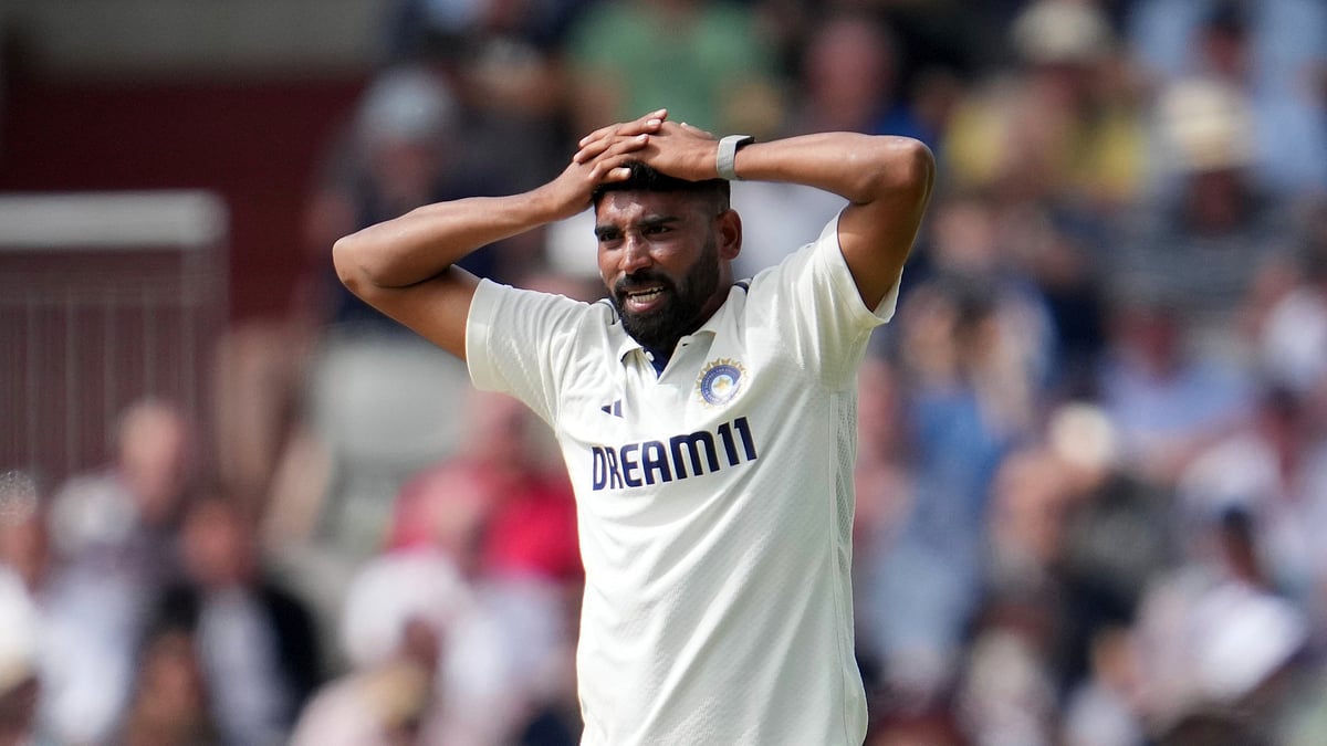 AP Photo/Jon Super : India's Mohammed Siraj reacts during the second day of the fourth cricket test match between England and India at Emirates Old Trafford, Manchester.