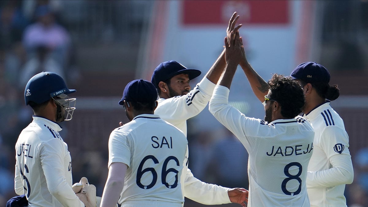 AP Photo/Jon Super : India's Ravindra Jadeja, second right, celebrates with teammates after the dismissal of England's Zak Crawley during the second day of the fourth cricket test match between England and India at Emirates Old Trafford, Manchester.