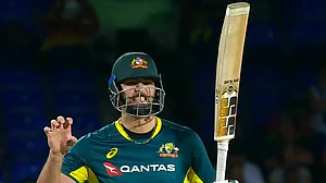 X : Tim David reacts after reaching his maiden T20I century.