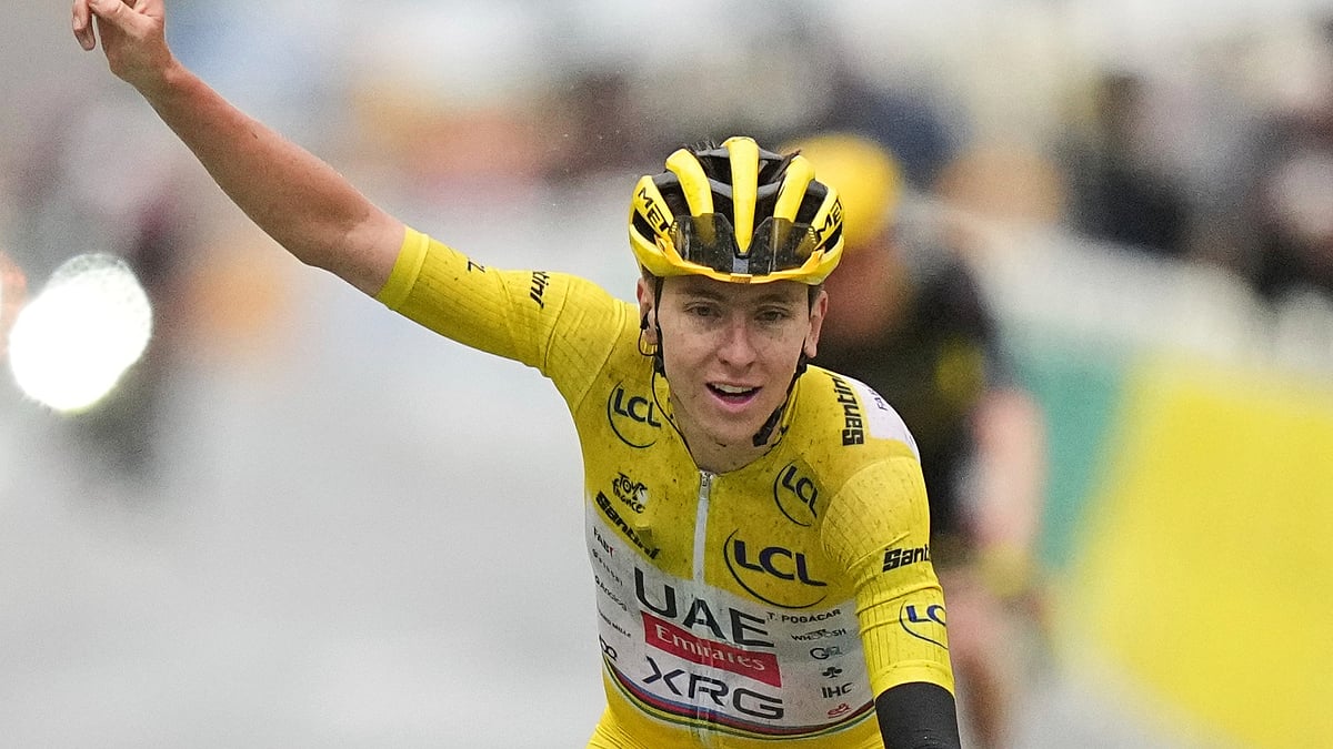 | Photo: AP/Thibault Camus : Tour de France 2025: Tour de France winner Tadej Pogacar of Slovenia crosses the finish line of the twenty-first stage of the Tour de France cycling race over 132.3 kilometers (82.1 miles) with start in Mantes-la-Ville and finish on the Champs-Elysees in Paris, France, Sunday, July 27, 2025.