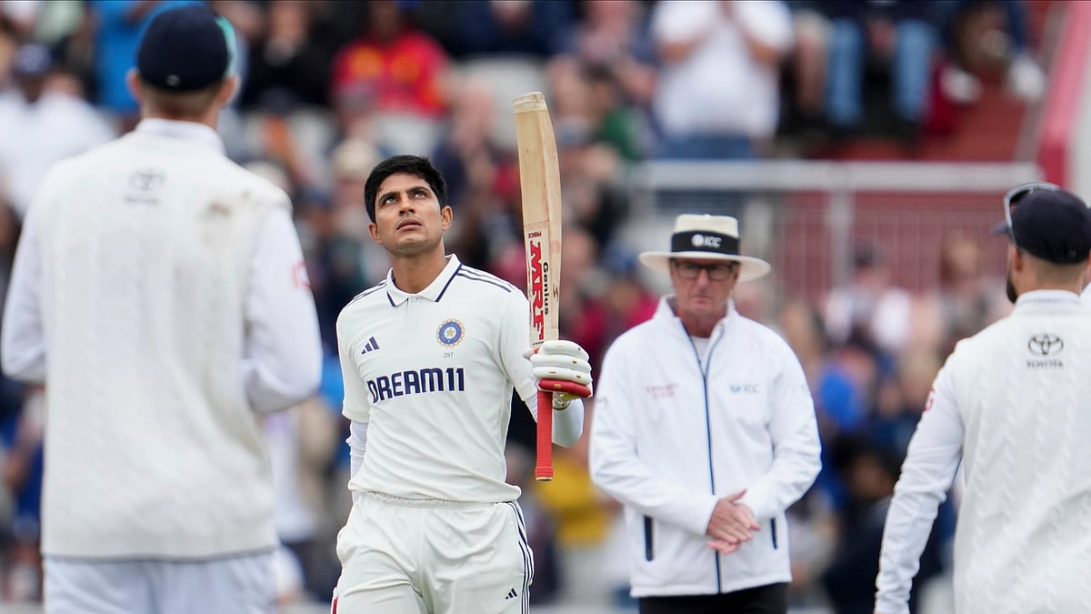 AP Photo/Jon Super : India's captain Shubman Gill celebrates after scoring a century on the final day of the fourth cricket test match between England and India at Emirates Old Trafford, Manchester.