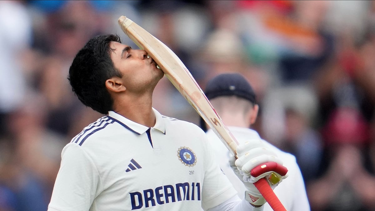 AP Photo/Jon Super : India's captain Shubman Gill celebrates after scoring a century on the final day of the fourth cricket test match between England and India at Emirates Old Trafford, Manchester.