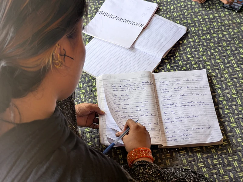 Poonams youngest daughter whos now married, shows her tuition copy.