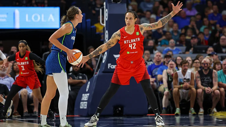 Brittney Griner #42 of the Atlanta Dream defends against Alanna Smith #8 of the Minnesota Lynx at Target Center on July 27, 2025 in Minneapolis, Minnesota. - null