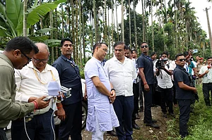 PTI : Assam Chief Minister Himanta Biswa Sarma with others during an inspection of sites for eviction drives at Uriamghat, in Golaghat district, Assam.