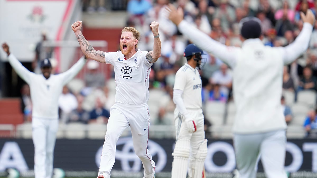 AP Photo/Jon Super : England's captain Ben Stokes celebrates with teammates after the dismissal of India's KL Rahul on the final day of the fourth cricket test match between England and India at Emirates Old Trafford, Manchester.