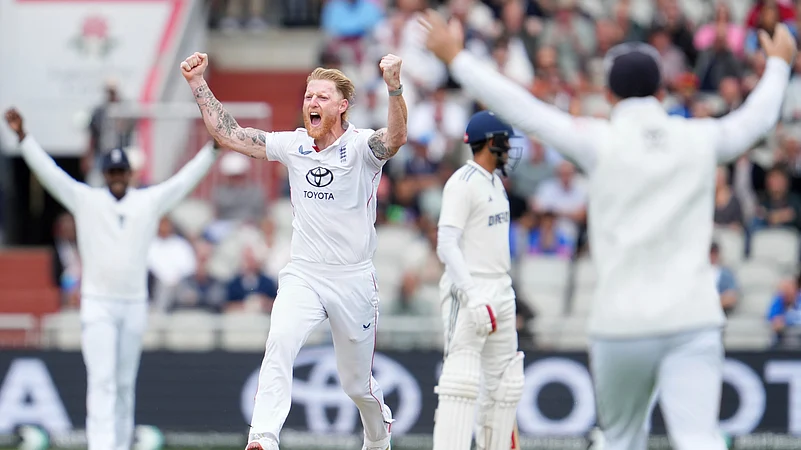 Englands captain Ben Stokes celebrates with teammates after the dismissal. AP