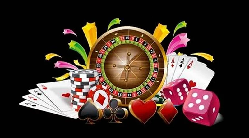 Roulette wheel, poker chips, dice and cards