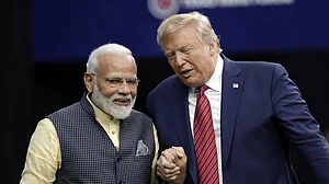 AP : US President Donald Trump (R) with PM Modi (R)