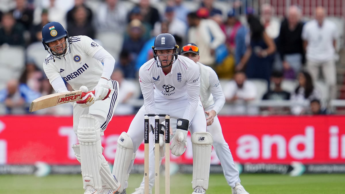 AP Photo/Jon Super : India's captain Shubman Gill plays a shot on the final day of the fourth cricket test match between England and India at Emirates Old Trafford, Manchester.